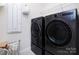 Well-equipped laundry room features modern appliances and ample storage space at 3252 Cheyney Park Dr, Charlotte, NC 28269