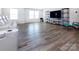 Bright living room features hardwood floors, large windows, and home theater setup at 3252 Cheyney Park Dr, Charlotte, NC 28269