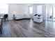 Bright living room with a modern sofa, stylish armchairs, and an abundance of natural light from large windows at 3252 Cheyney Park Dr, Charlotte, NC 28269