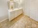 Bathroom showcasing double sinks, ample cabinet space, and easy access to a walk-in closet at 3510 Heathcott Cir, Charlotte, NC 28262