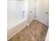 Bathroom showcasing a clean white bathtub and tiled flooring at 3510 Heathcott Cir, Charlotte, NC 28262