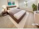 Staged primary bedroom with a large bed, modern decor, and plush rug at 3510 Heathcott Cir, Charlotte, NC 28262