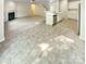 Stylish kitchen with eat-in bar and stainless appliances opens to carpeted living room at 3510 Heathcott Cir, Charlotte, NC 28262