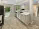 Open kitchen with stainless appliances and eat-in bar, seamlessly flowing into living area at 3510 Heathcott Cir, Charlotte, NC 28262