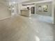 Open concept living room and kitchen offers an airy feel with neutral colors at 3510 Heathcott Cir, Charlotte, NC 28262