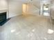 Spacious living room includes a fireplace, neutral paint, and plush carpeting at 3510 Heathcott Cir, Charlotte, NC 28262