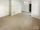 Bright living room featuring neutral paint, carpeting, and an open floor plan at 3510 Heathcott Cir, Charlotte, NC 28262