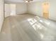 Expansive main bedroom featuring plush carpet, natural light, and ensuite bathroom at 3510 Heathcott Cir, Charlotte, NC 28262