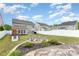 Spacious backyard with a fire pit, seating area, and playhouse provides outdoor enjoyment at 3618 Catherine Creek Pl, Davidson, NC 28036