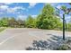 Outdoor basketball court featuring well-maintained asphalt, hoops, and green surroundings at 3618 Catherine Creek Pl, Davidson, NC 28036
