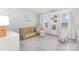 Charming Bedroom features a wooden crib, chair, and playful decor, creating a warm and inviting space at 3618 Catherine Creek Pl, Davidson, NC 28036