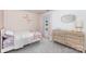 Cozy bedroom with soft carpet, a comfortable bed, and a dresser creates a relaxing atmosphere at 3618 Catherine Creek Pl, Davidson, NC 28036