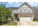 Charming two-story home featuring a two-car garage and a welcoming blue front door at 3618 Catherine Creek Pl, Davidson, NC 28036