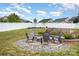 Outdoor fire pit with seating and landscaping makes for cozy evenings and relaxation at 3618 Catherine Creek Pl, Davidson, NC 28036