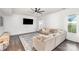 Spacious living room featuring a large sectional sofa, TV, and bright natural light at 3618 Catherine Creek Pl, Davidson, NC 28036