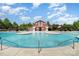 Beautiful community pool, surrounded by lush greenery and pergola-covered seating areas at 3618 Catherine Creek Pl, Davidson, NC 28036