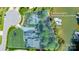 Aerial view of a waterfront property showcasing the pool, outdoor amenities, and the home's location on the lake at 3992 Blue Dory Ln, Denver, NC 28037