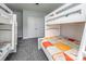 Bedroom featuring 2 bunk beds with an adjacent closet, and a neutral color scheme at 3992 Blue Dory Ln, Denver, NC 28037