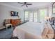 Bright bedroom with a bed, dresser, and a window with a view of the outside at 3992 Blue Dory Ln, Denver, NC 28037