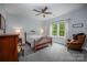 Comfortable bedroom featuring ceiling fan, stylish decor, and ample natural light at 3992 Blue Dory Ln, Denver, NC 28037