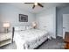 Comfortable bedroom featuring ceiling fan, stylish decor, and ample natural light at 3992 Blue Dory Ln, Denver, NC 28037