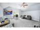 Bright bonus room featuring sitting area, media center, and natural light at 3992 Blue Dory Ln, Denver, NC 28037