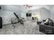 Spacious bonus room with vaulted ceiling, media center, sitting area, and natural light at 3992 Blue Dory Ln, Denver, NC 28037