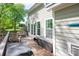 Inviting deck featuring a hot tub and several seating areas at 3992 Blue Dory Ln, Denver, NC 28037