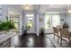 Inviting entryway with hardwood floors, natural light, and views into the dining area and front yard at 3992 Blue Dory Ln, Denver, NC 28037
