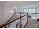Bright foyer showcasing staircase, chandelier, and view to lower level at 3992 Blue Dory Ln, Denver, NC 28037