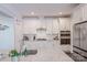 Modern kitchen with white cabinetry, stainless steel appliances, and granite countertops at 3992 Blue Dory Ln, Denver, NC 28037