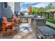 Outdoor kitchen area with built-in grill, stainless storage, brickwork, and a charming rug at 3992 Blue Dory Ln, Denver, NC 28037