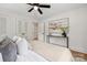 Bright bedroom featuring fresh white paint, modern art, and a ceiling fan, creating a serene and inviting atmosphere at 4021 Paisley Pl, Charlotte, NC 28208