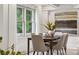 Well-lit dining room featuring a classic table setting, and elegant decor at 4021 Paisley Pl, Charlotte, NC 28208