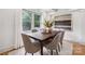 Bright dining room with coffered ceilings, large windows, and a modern table set at 4021 Paisley Pl, Charlotte, NC 28208