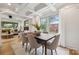 Elegant dining room flows into a living space with natural light and inviting ambiance at 4021 Paisley Pl, Charlotte, NC 28208