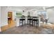 Open-concept kitchen with bar seating, modern lighting, and seamless flow into adjacent living areas at 4021 Paisley Pl, Charlotte, NC 28208