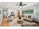 Inviting living room featuring hardwood floors, natural light, and contemporary decor at 4021 Paisley Pl, Charlotte, NC 28208