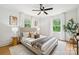 Serene main bedroom with natural light, stylish decor, and hardwood floors, creating a relaxing atmosphere at 4021 Paisley Pl, Charlotte, NC 28208