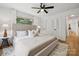 Spacious main bedroom featuring plush bedding, stylish decor, and hardwood floors, ideal for relaxation at 4021 Paisley Pl, Charlotte, NC 28208