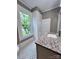 Bathroom features stylish black and white floors, white cabinets and a granite countertop at 419 S Spencer Ave, Spencer, NC 28159