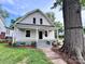 Charming two-story home featuring a cozy front porch and meticulously landscaped front yard with a beautiful large shade tree at 419 S Spencer Ave, Spencer, NC 28159