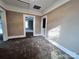 Open room has carpeting, doorways, and light-colored trim and walls at 419 S Spencer Ave, Spencer, NC 28159