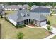 An aerial view shows the home is surrounded by lush landscaping with a well-manicured lawn at 45523 Misty Bluff Dr, Charlotte, NC 28278