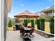 An outdoor patio, perfect for entertaining, complete with a grill, seating and manicured landscaping at 45523 Misty Bluff Dr, Charlotte, NC 28278