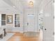 Bright foyer with hardwood floors, elegant lighting, and a view into the living spaces at 45523 Misty Bluff Dr, Charlotte, NC 28278