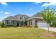 Charming brick home with a well-manicured lawn, beautiful landscaping, and a two-car garage at 45523 Misty Bluff Dr, Charlotte, NC 28278