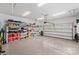 Spacious two car garage with epoxy floors, an automatic door, and shelving for plenty of storage at 45523 Misty Bluff Dr, Charlotte, NC 28278