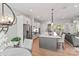 Bright kitchen featuring stainless steel appliances, custom cabinets, and a large center island at 45523 Misty Bluff Dr, Charlotte, NC 28278