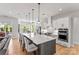 Modern kitchen featuring a large center island, stainless steel appliances, and custom cabinetry at 45523 Misty Bluff Dr, Charlotte, NC 28278